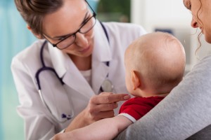 Baby boy with mother at doctor's office