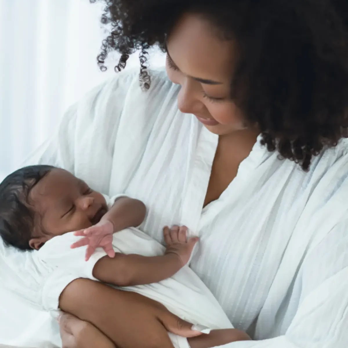 newborn care specialist holding baby
